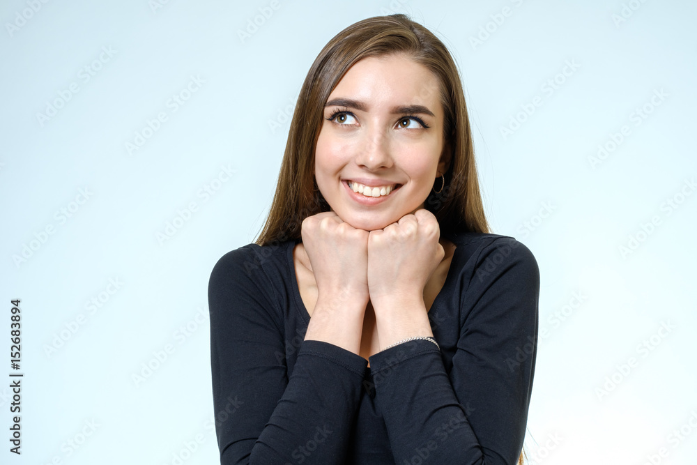 Portrait of a beautiful young woman looking at the camera and smiling Portrait of a beautiful young woman looking at the camera and smiling