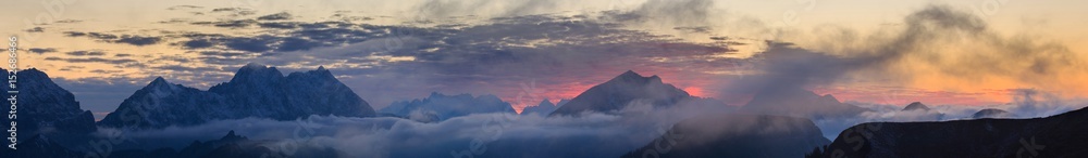 Burning sunset over mountains panorama