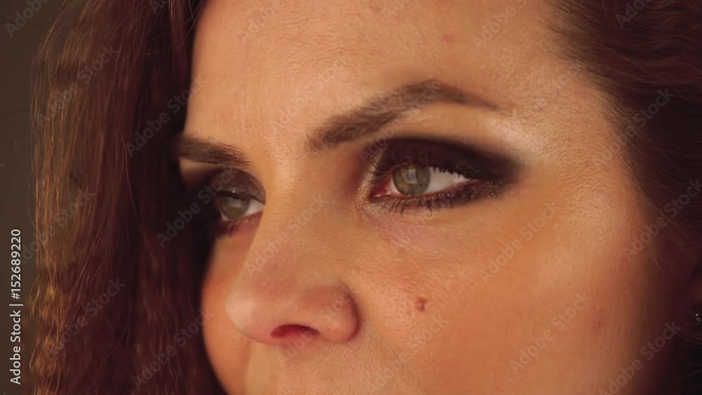 Close up of woman's face with smoky eyes make up. Close up of woman's face with smoky eyes make up.