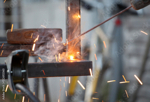 Sparks and jets of smoke when welding