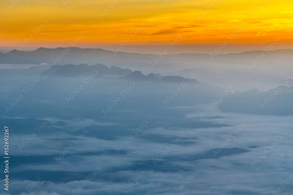 Mountain layer with fog and cloud at dawn