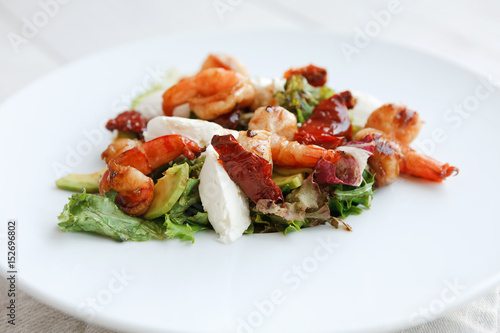 Traditional italian seafood salad with shrimps and mozzarella