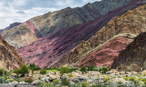 Colorful cliffs along the Leh-Manali highway on the way from Leh to the pass Tanglang La near Gui - Tibet, Leh district, Ladakh, Himalayas, Jammu and Kashmir, Northern India photo