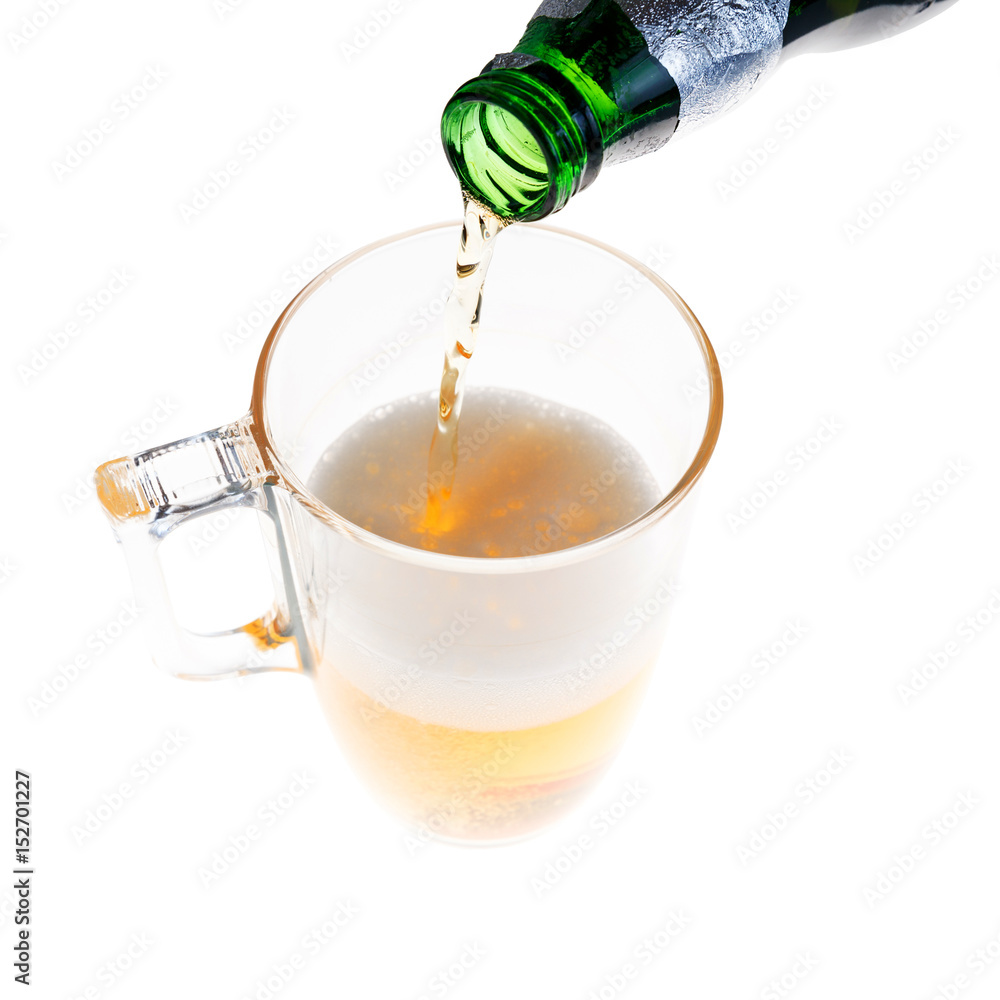 Pouring light beer in the mug Pouring light beer in the mug