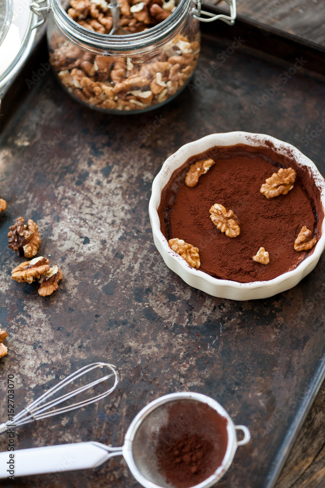 Fototapeta premium Chocolate souffle with walnuts and cocoa powder