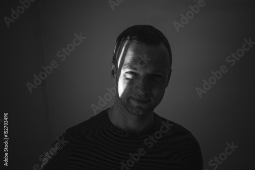 Artistic studio portrait of young adult man