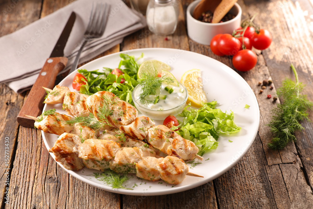 grilled chicken skewer and salad