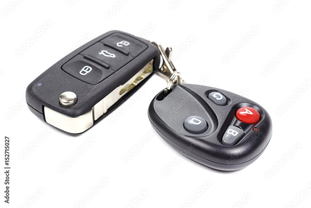 Garage door remote control with closed ignition key on a white background