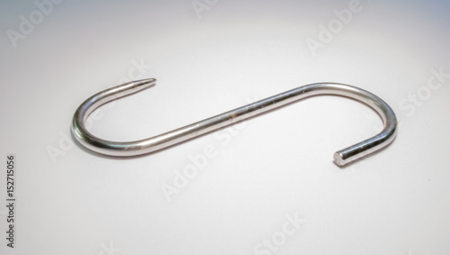 stainles steel meat hook on white