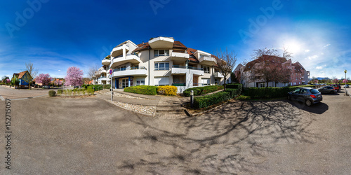 360-degree panoramic view of calm place with modern apartment house, flowering springtime, Obernai, France