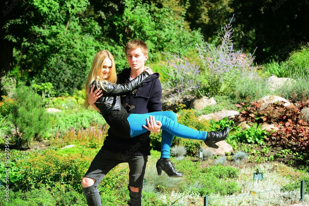 Young couple in Vilnius town Bernardinu garden on autumn