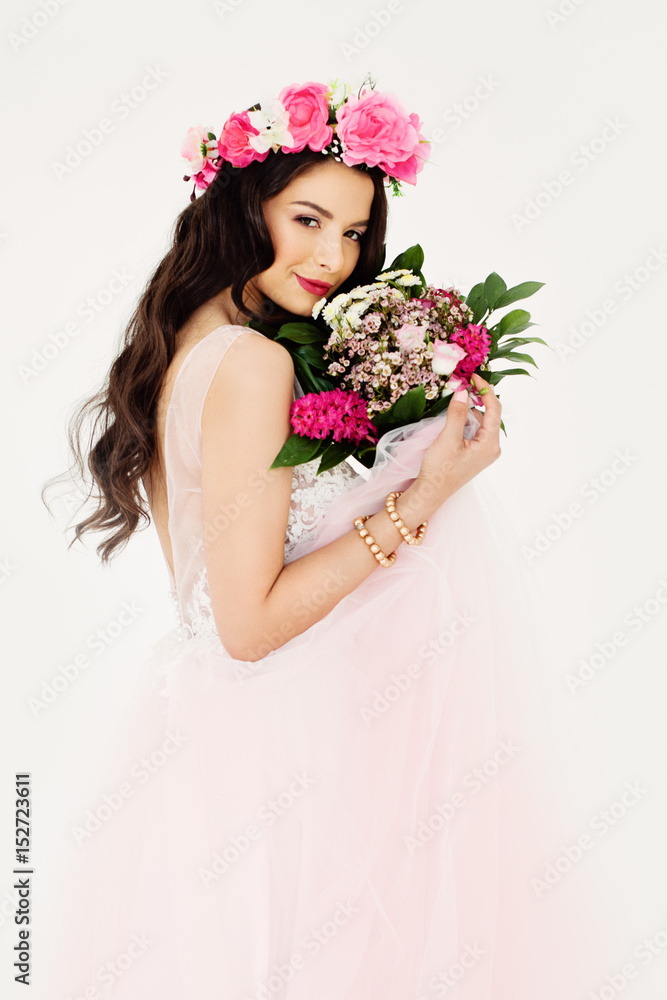 Beautiful Woman with Colorful Flower Arrangement, Flower Wreath, Bridal Hairstyle and Makeup on White