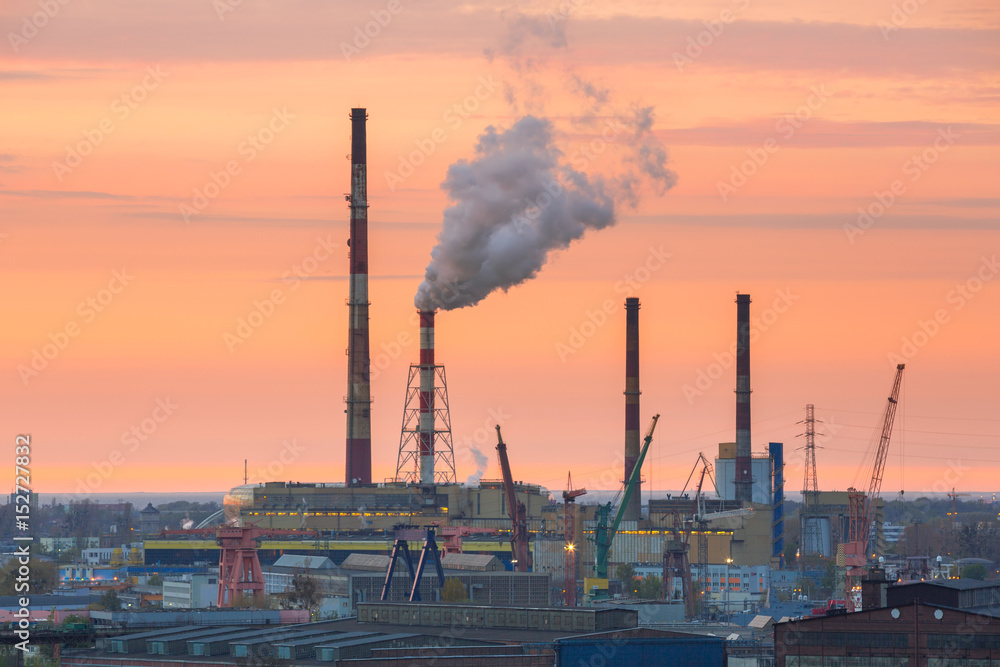 Chimneys of heating plant in Gdansk at sunset, Poland