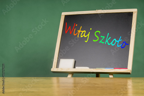 Educational concept - school elements relating to the chalkboard photo