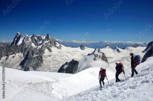 people hiking in winte mountains