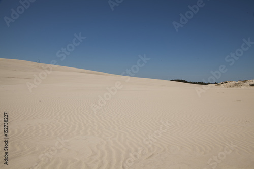 Sand, dunes, blue sky