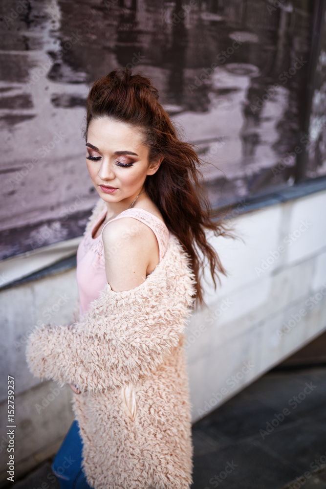 Beautiful young woman with long brown hair posing at the ..outdoors Beautiful young woman with long brown hair posing at the ..outdoors
