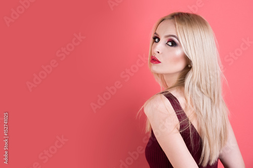 beautiful woman with blonde hair, fashionable makeup and red lips