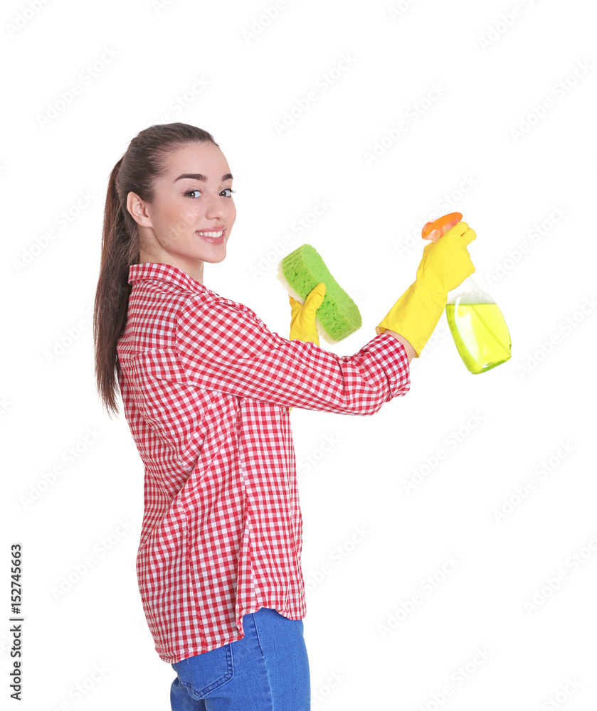 Beautiful young woman holding sponge and cleanser spray on white background Beautiful young woman holding sponge and cleanser spray on white background