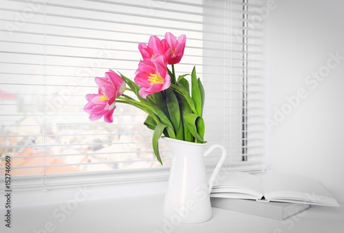 Fototapeta Naklejka Na Ścianę i Meble -  Bouquet of beautiful tulip flowers on windowsill