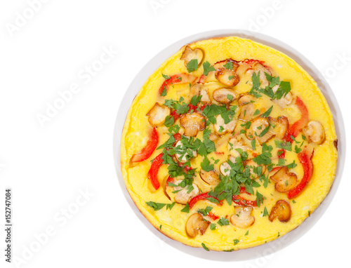 omelet with mushrooms, and vegetables. top view. isolated on white