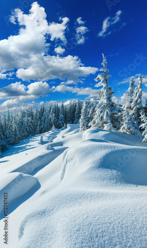 Snowdrifts on winter snow covered mountainside