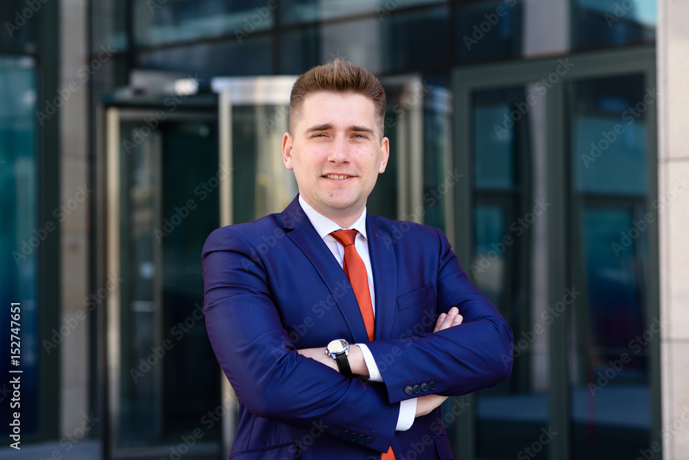 A successful businessman in a blue suit and Red tie. A successful businessman in a blue suit and Red tie.