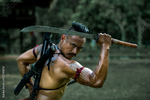 Ancient warrior man of soldier of Bang Rachan District Thailand  hold sword ready fighter photo