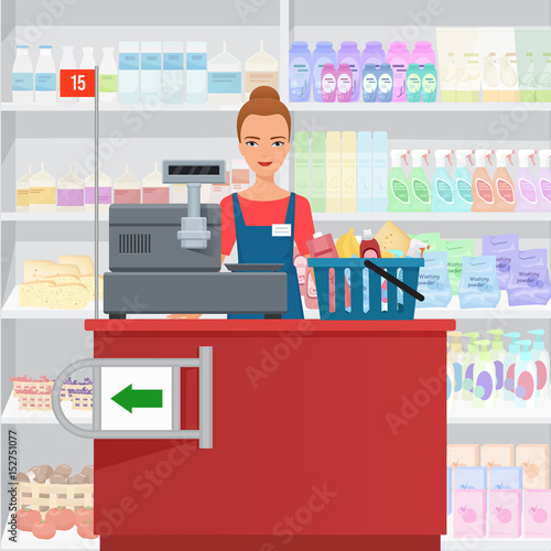 Saleslady woman cashier standing at checkout in supermarket.