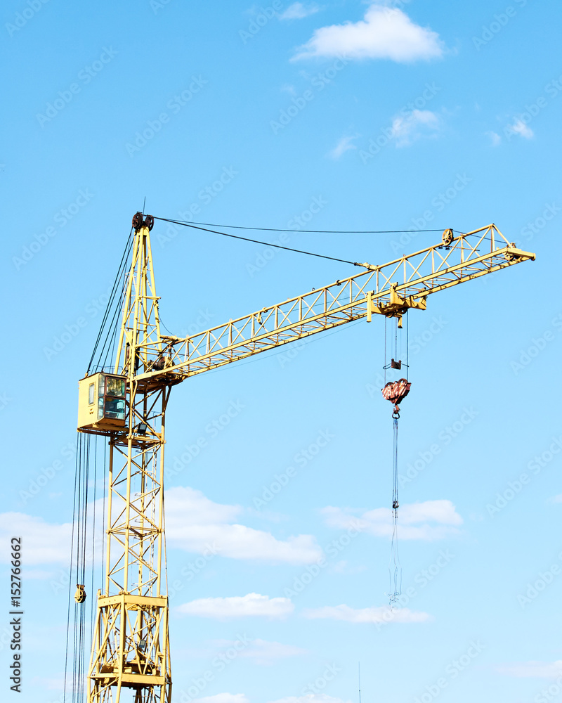 Cranes for construction have sky background