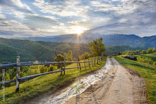 Beautiful spring landscape with old farm in mountains