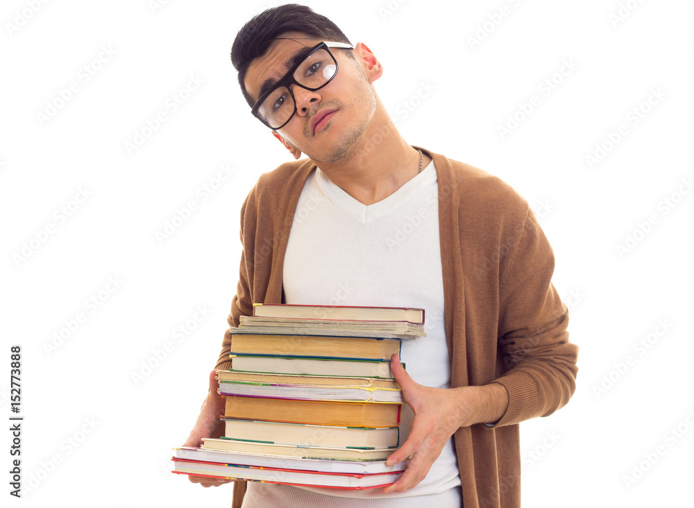 Young man in glasses with books