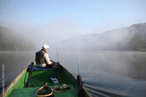 Fisherman in boat / Spin fishing in Solina Lake.
