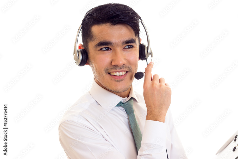 Young man in headphones holding a folder Young man in headphones holding a folder