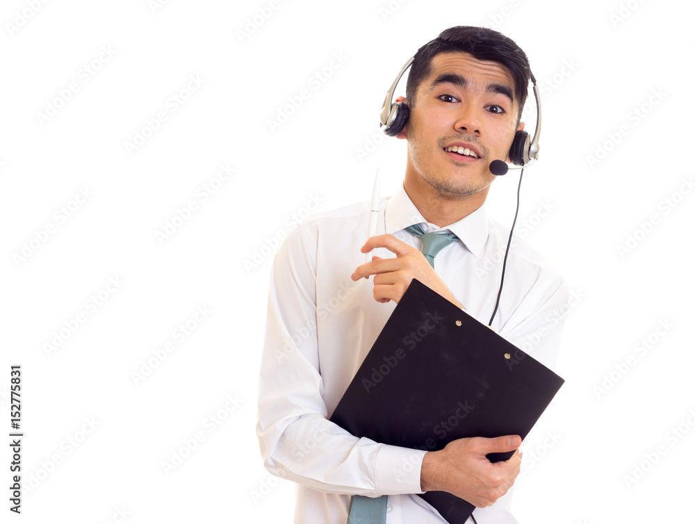 Young man in headphones holding a folder Young man in headphones holding a folder