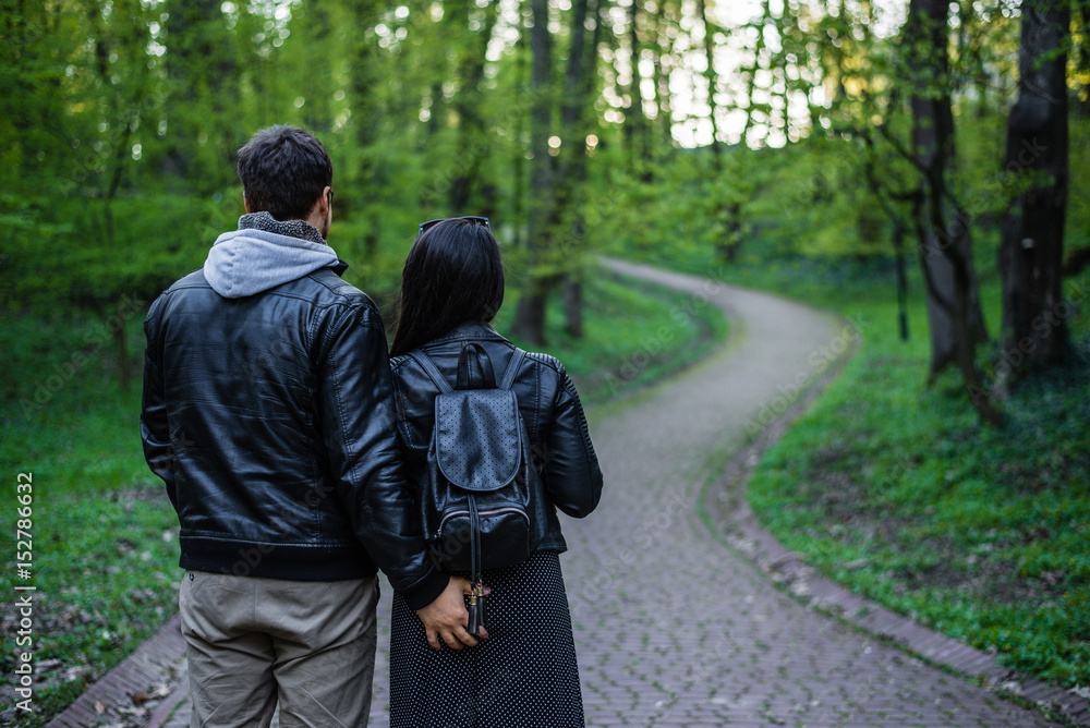 man tocuhs womans ass while walking in park man tocuhs womans ass while walking in park