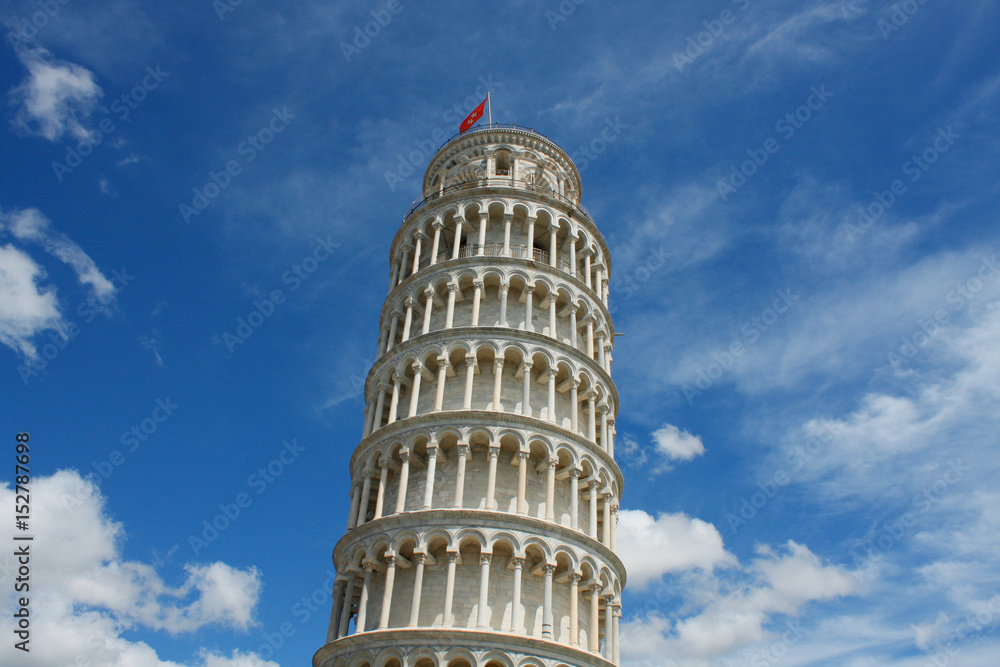 Leaning tower of Pisa, Italy, on a bright sunny day with blue sky and copy space for text