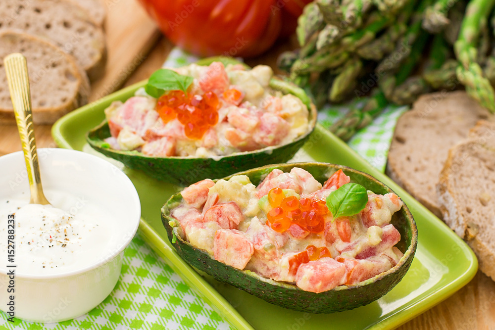 Stuffed avocado with tomato, garlic and mayonnaise Stuffed avocado with tomato, garlic and mayonnaise