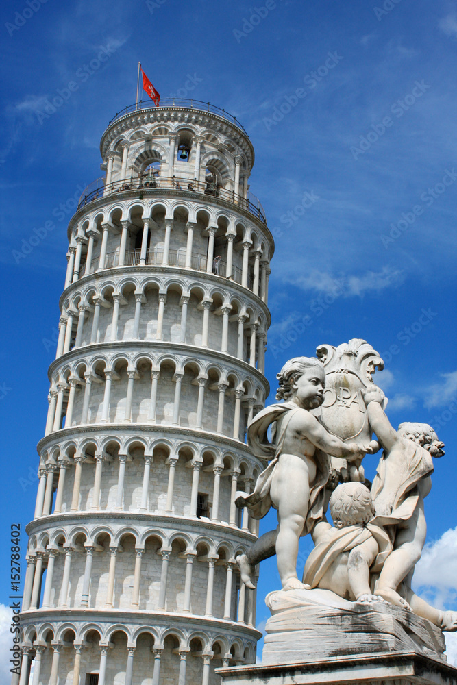 Leaning tower and Pisa cathedral on a bright sunny day in Pisa, Italy