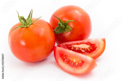 red tomato vegetable with slice isolated on white background