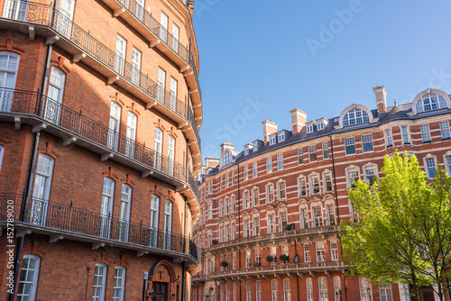 Photography Opulent restored elegant Victorian period building in red bricks and white windo