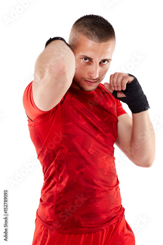 Young kickbox fighter on white