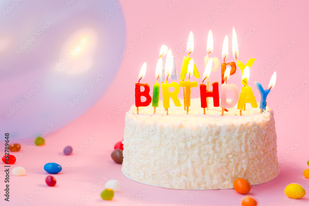 Happy Birthday cake with candles on pink background with balloons Stock  Photo | Adobe Stock