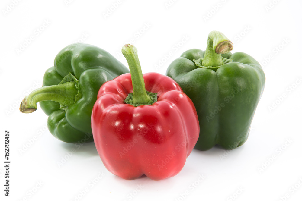 Red and green capsicum or sweet pepper isolated on white background Red and green capsicum or sweet pepper isolated on white background