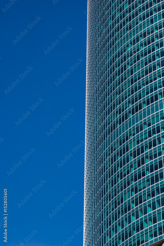 glass reflective office buildings against blue sky glass reflective office buildings against blue sky