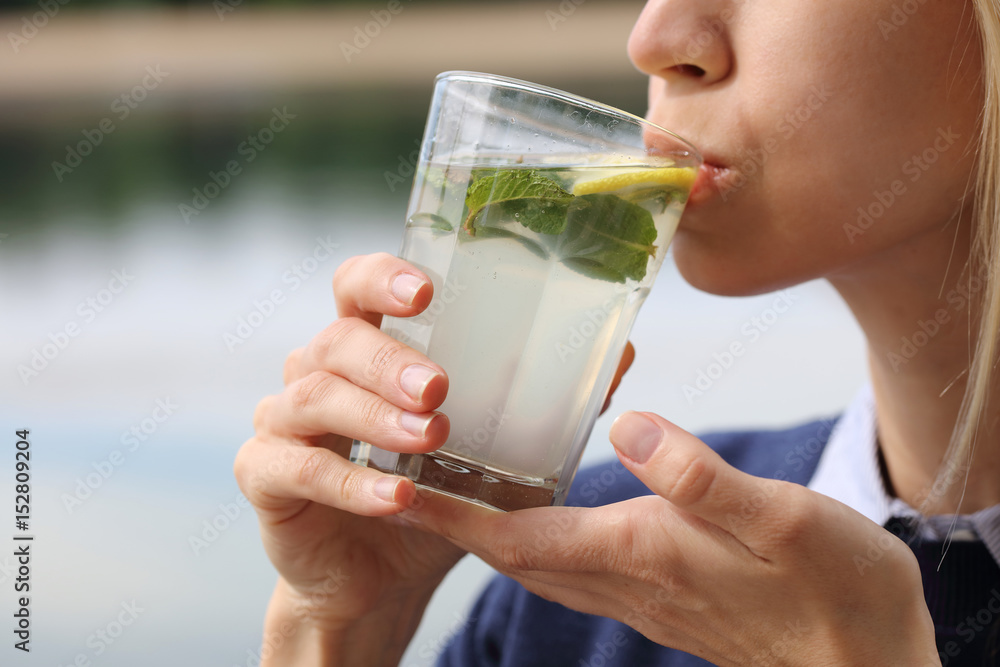 Happy Woman Drinking Summer Refreshing detox Water or Lemonade. Happy Woman Drinking Summer Refreshing detox Water or Lemonade.