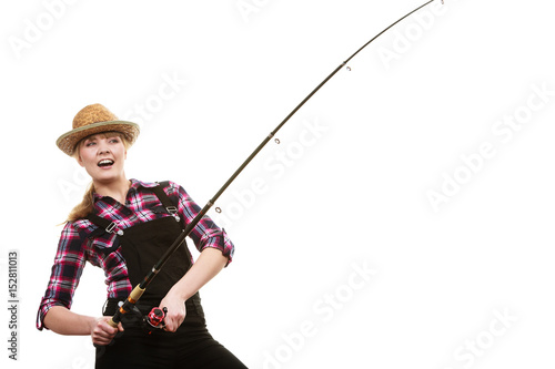 Happy woman in sun hat holding fishing rod
