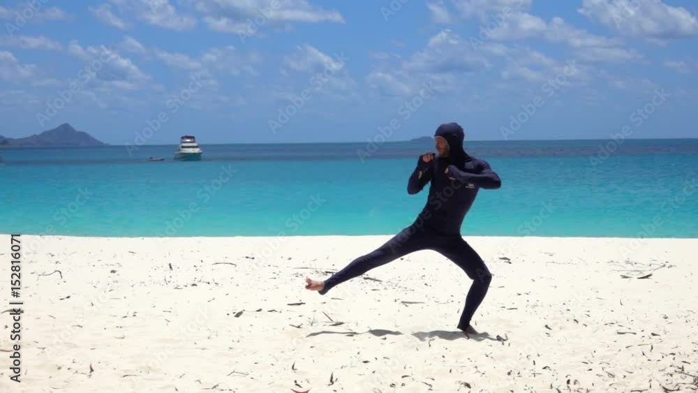 Young Man Perform Martial Art Move on the Beach, Slow Motion Young Man Perform Martial Art Move on the Beach, Slow Motion