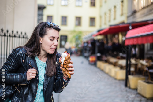 woman eat icecream oustide