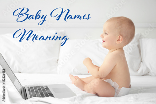 Cute baby boy with laptop o...